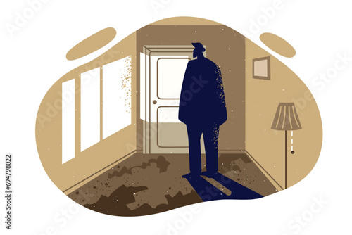 Silhouette lonely man standing in abandoned room and in need of social adaptation after bankruptcy