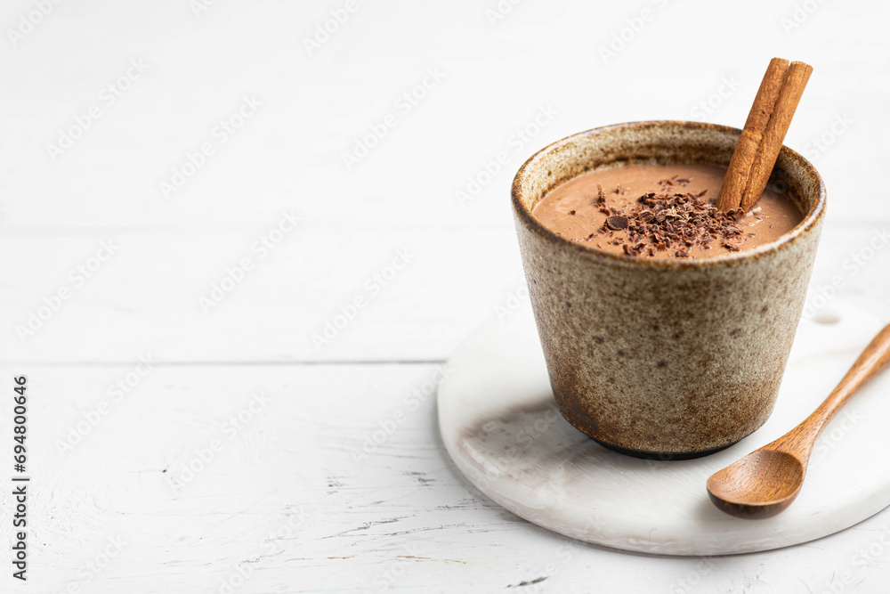Fotografie Hot chocolate drink in ceramic cup, selective focus, copy space