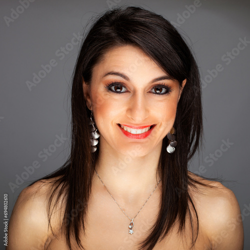 Radiant smile - cheerful young woman portrait