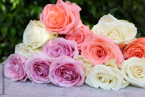 Beautiful bouquet of roses on light grey table outdoors  closeup