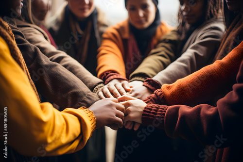 Business Team Huddle. Diverse Friends Hands Commitment.High angle view of a team of united coworkers standing with their hands together in a huddle.Ai photo