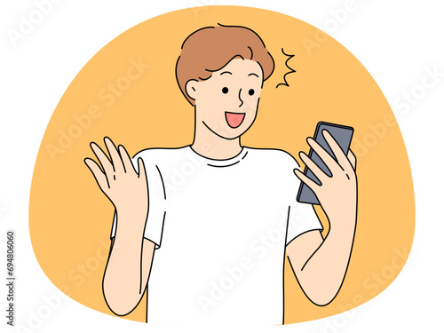 Excited man look at cell stunned by good news