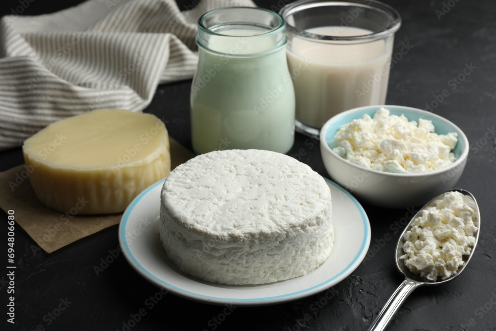 Many different lactose free dairy products on black textured table, closeup Many different lactose free dairy products on black textured table, closeup