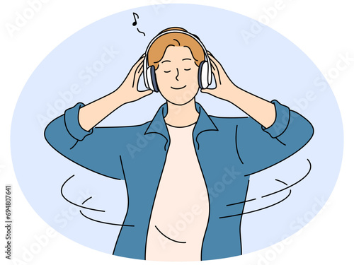 Happy man listen music in earphones