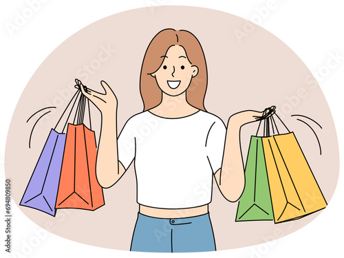 Smiling woman with shopping bags