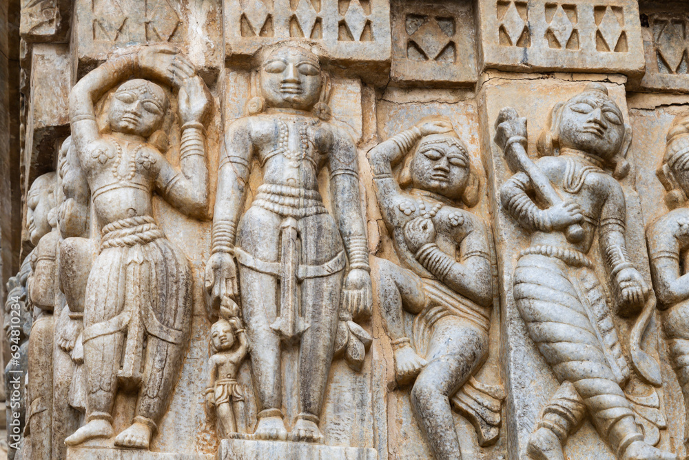 Sculptures of musicians and dancers on hindu holy temple wall at day Sculptures of musicians and dancers on hindu holy temple wall at day