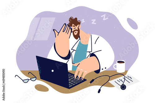Sleepy doctor sits at desk and falls asleep due to lack of rest or working overtime.
