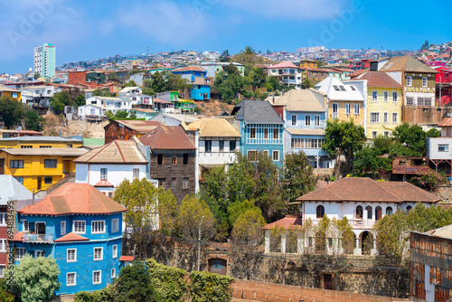 Colorful houses in town on sunny day, Cerro San Juan de Dios, Valparaiso, Valparaiso Province, Valparaiso Region, Chile photo