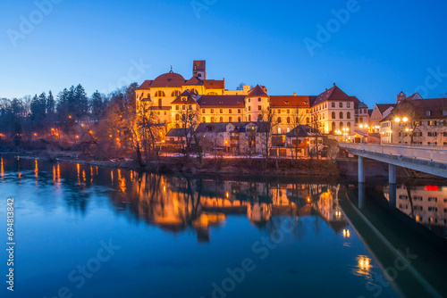 St. Mang abbey and Hohes Schloss with river Lech, Fussen, Allgau, Swabia, Bavaria, Germany © AWL Images