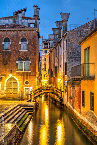 Night picturesque view of a water canal, Venice, Veneto, Italy photo