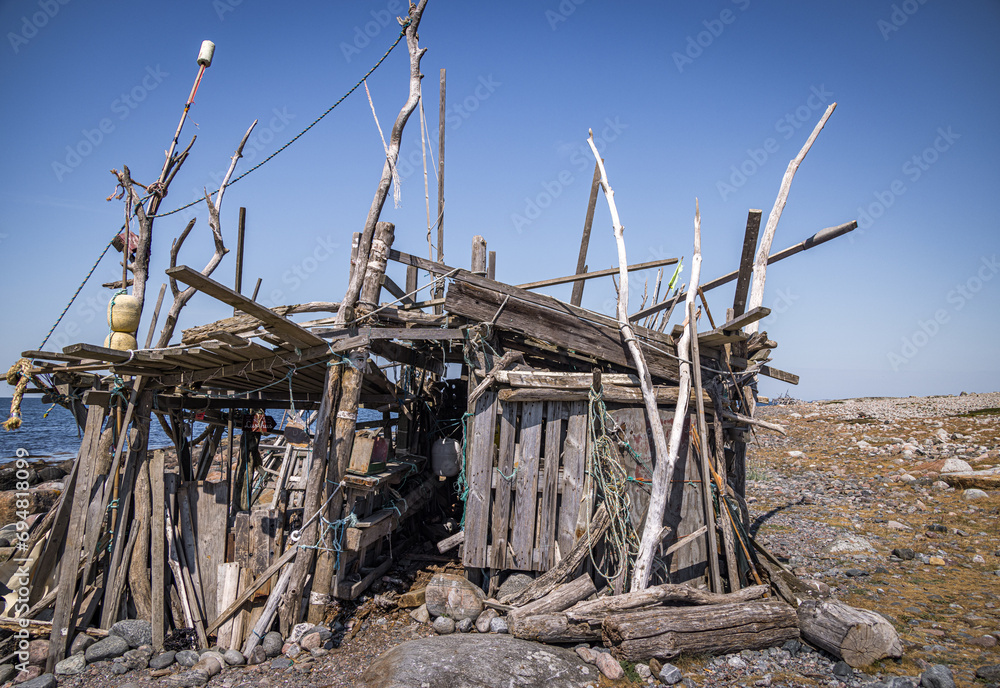 Old wooden shack on the beach on Rörö island, Gothenburg archipelago, Sweden Old wooden shack on the beach on Rörö island, Gothenburg archipelago, Sweden