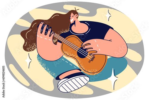 Smiling woman playing guitar