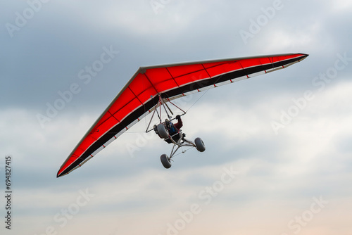 Red wing hang glider trike