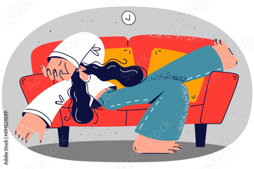 Tired woman sleeping on sofa