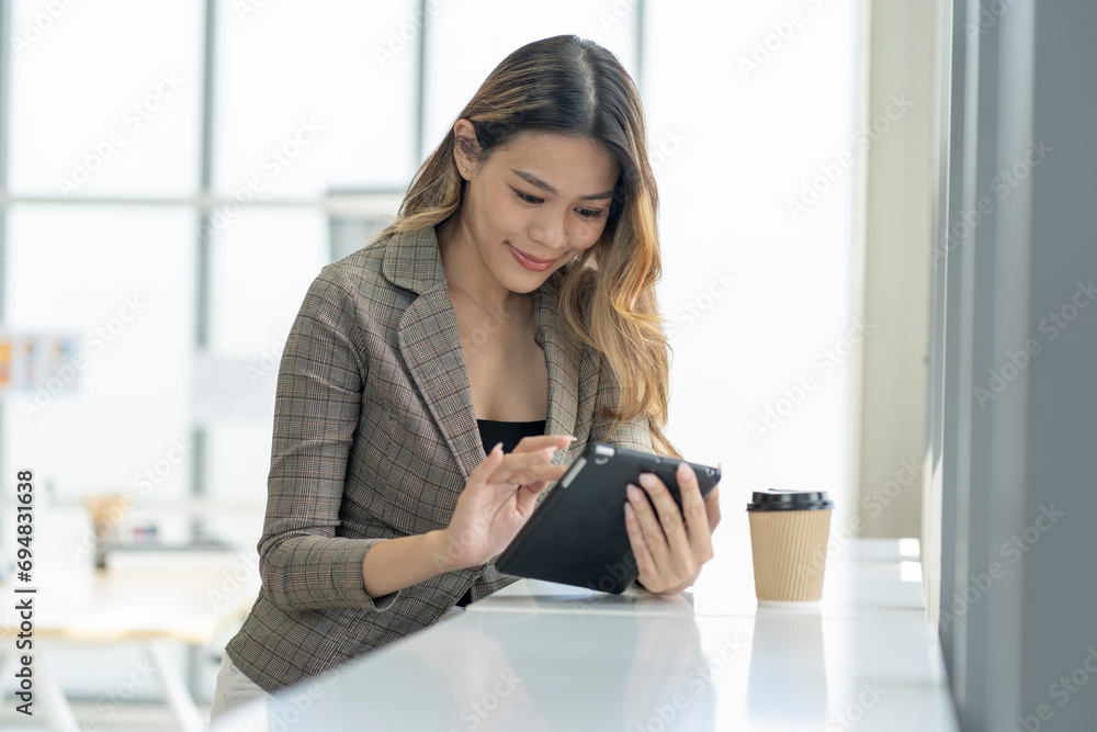 A determined young woman propels business growth with unwavering resolve in the office. A determined young woman propels business growth with unwavering resolve in the office.