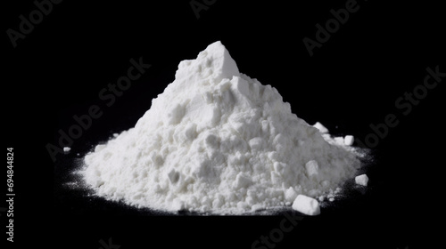 Pile of white powder looking like cocaine or amphetamine isolated on black background