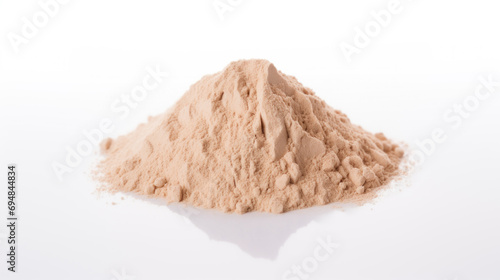 Heap of brown powder depicting heroin isolated on white background