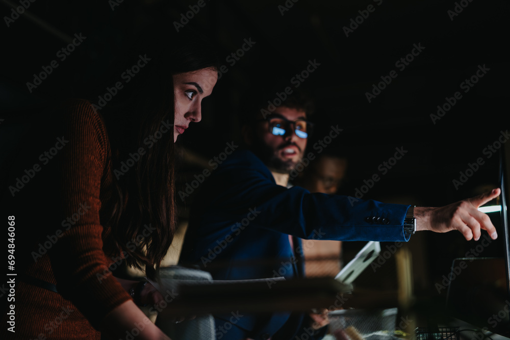 Diverse business team collaborates on project deadline, analyzing reports and discussing strategies for growth and profitability. Diverse business team collaborates on project deadline, analyzing reports and discussing strategies for growth and profitability.