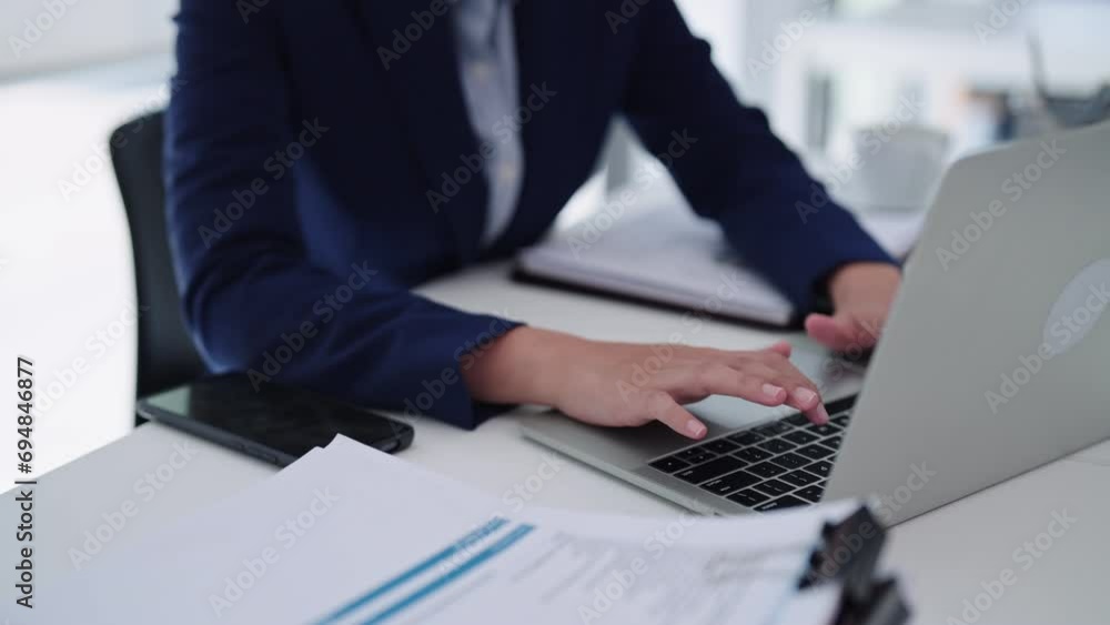 As an industrious Asian businesswoman, she navigates through her accounting tasks and projects with determination, utilizing her computer laptop at a thoughtfully organized office desk. As an industrious Asian businesswoman, she navigates through her accounting tasks and projects with determination, utilizing her computer laptop at a thoughtfully organized office desk.