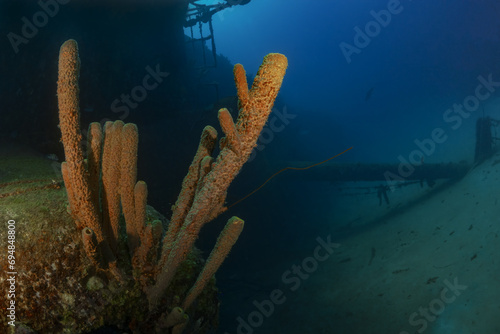 Mysterious underwater scene with sunken shipwreck photo