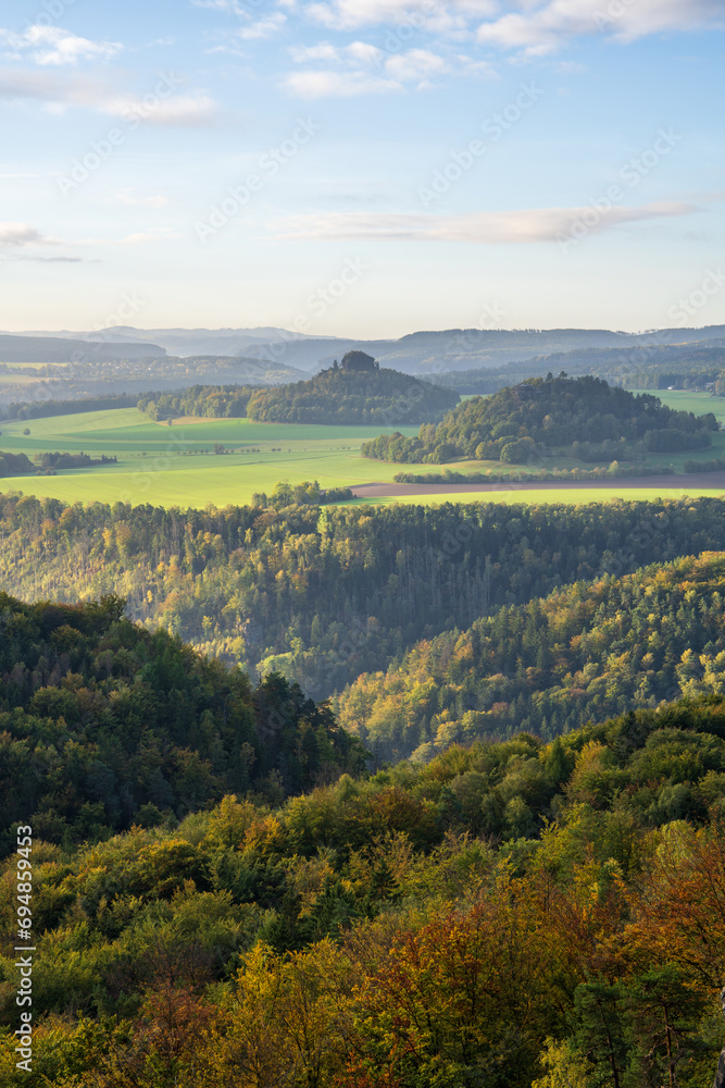 Stunning mountain views from a cliff at a very high altitude. Picturesque landscape with beautiful views in the sunlight. Saxon Switzerland, near Dresden, Germany