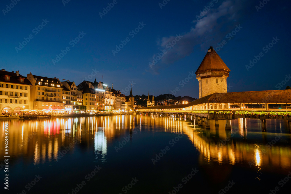 Historic city center of Lucerne with famous Chapel Bridge in twilight tome, Canton of Lucerne, Switzerland