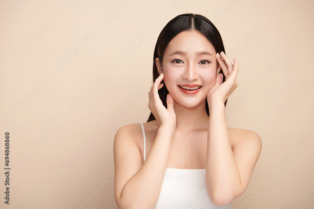 Beautiful young asian woman with clean fresh skin on beige background, Face care, Facial treatment, Cosmetology, beauty and spa, Asian women portrait. Beautiful young asian woman with clean fresh skin on beige background, Face care, Facial treatment, Cosmetology, beauty and spa, Asian women portrait.