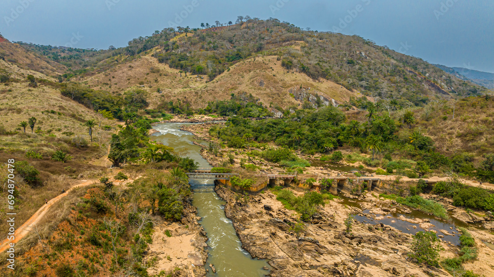 Aerial of an old railway bridge over the Cuvo River (Rio Keve), near ...