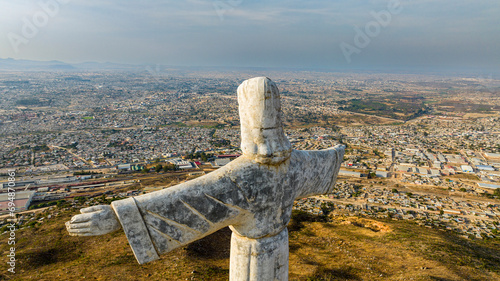 Aerial of the Christ the King Statue, overlooking Lubango, Angola photo