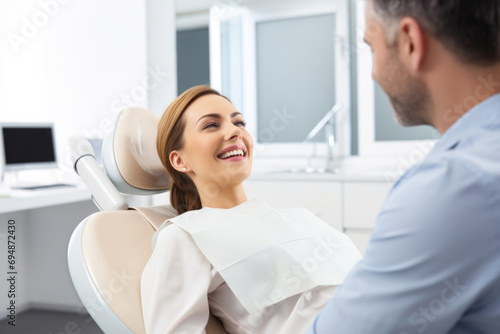 smiling woman with beautiful teeth in a dental chair in a dentist s office clinic. Treatment and prevention of dental disease