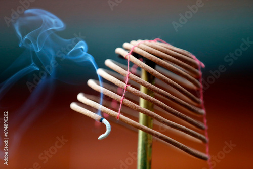 Burning spiral incense sticks in Taoist ceremony, Mau Son Taoist temple, Sapa, Vietnam, Indochina photo