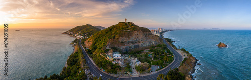 Aerial view of Vung Tau city, Vietnam, panoramic view of the peaceful and beautiful coastal city behind the statue of Christ the King standing on Mount Nho in Vung Tau city. photo