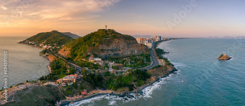 Aerial view of Vung Tau city, Vietnam, panoramic view of the peaceful and beautiful coastal city behind the statue of Christ the King standing on Mount Nho in Vung Tau city.