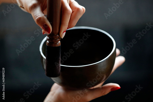 Bowl in the hands of prayer, Tibetan singing bowl, Buddhist instrument used in sound therapy, meditation and yoga, Quang Ninh, Vietnam, Indochina, Southeast Asia, Asia photo