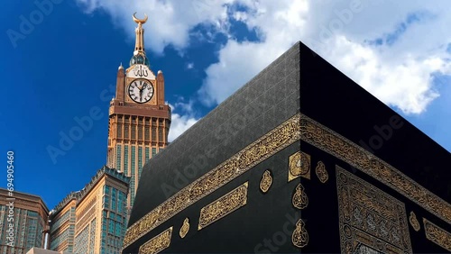 Timelapse of Holy mosque of Mecca and Makkah Clock Royal Tower. Haram Mosque minaret in a cloudy day. Mecca, Islam’s holiest city and the central Masjid al-Haram, Sacred Mosque surrounds the Kaaba. photo