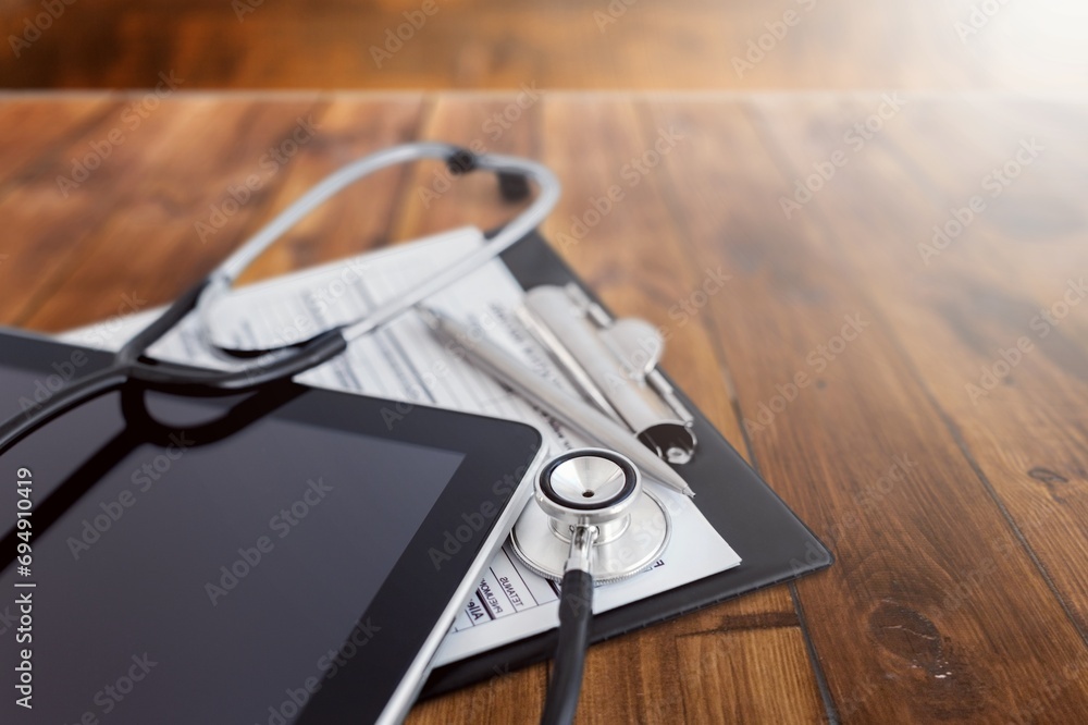 Medical hospital setting, stethoscope and documents Medical hospital setting, stethoscope and documents