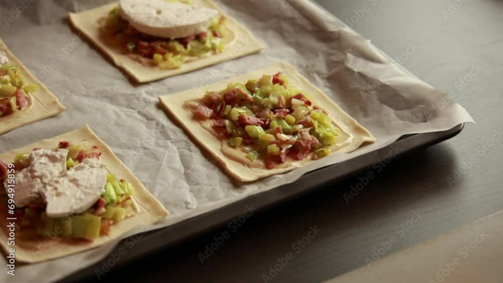 Close-Up Preparing Delight: Tart with Puff Pastry, Leek, Bacon, and Goat Cheese - Culinary Craft Close-Up Preparing Delight: Tart with Puff Pastry, Leek, Bacon, and Goat Cheese - Culinary Craft