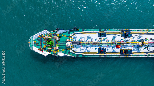 Aerial top view LPG gas ship, Ship tanker gas LPG top view on the sea for transportation, Liquefied Petroleum Gas tanker or LPG anchored in deep blue ocean sea. © Darunrat