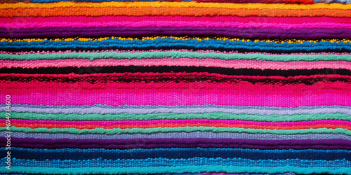 Cinco de Mayo party decor background. Mexican fabric or rug pattern with colorful stripes. Mexican Serape design banner.