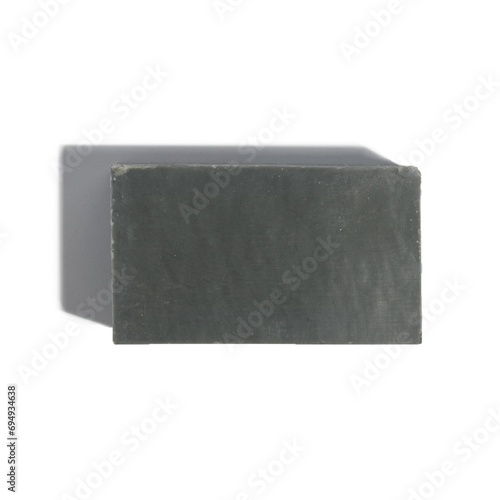 Bar of natural chunky soap on white background with strong shadow 