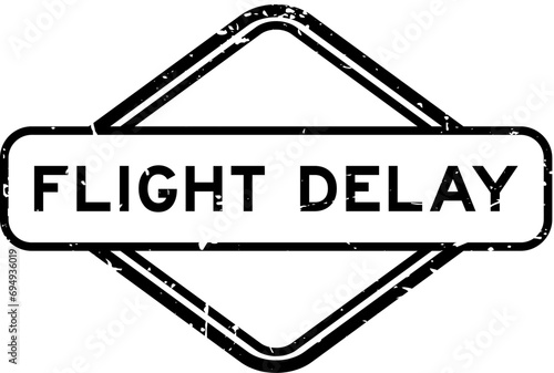 Grunge black flight delay word rubber seal stamp on white background