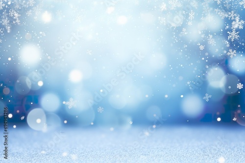 Christmas blue background with bokeh and snowflakes © Abdullah Tsani