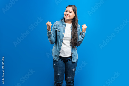 Asian excited women clenched fist and celebrating success © Dharma