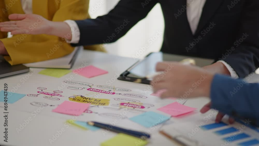 Closeup of handsd Teamwork business group are meeting working and brainstorming about business financial and marketing on paperwork and presentation. Closeup of handsd Teamwork business group are meeting working and brainstorming about business financial and marketing on paperwork and presentation.