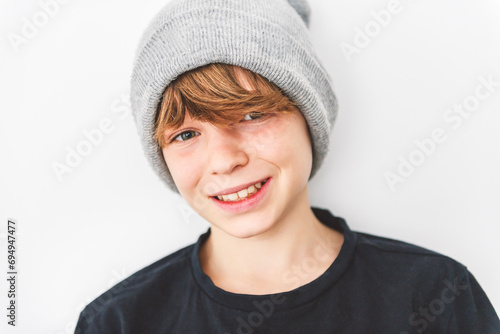 Teen boy in blank black wearing gray toque t-shirt, isolated on white background.