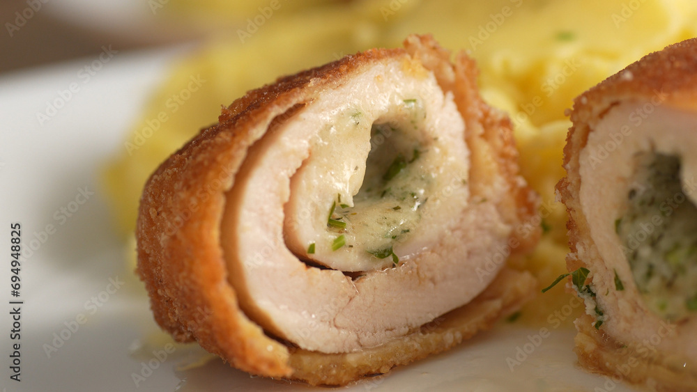 Halved Kiev Cutlet with Mashed Potatoes. Close-up, shallow dof. Halved Kiev Cutlet with Mashed Potatoes. Close-up, shallow dof.