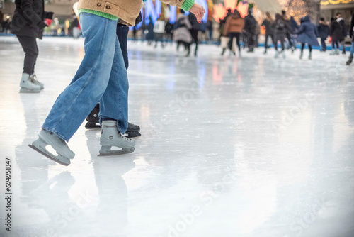 Toronto Ontario, Canada-December 12th, 2023: Skates on the ice at Toronto City Hall’s Nathan Phillips Square. photo