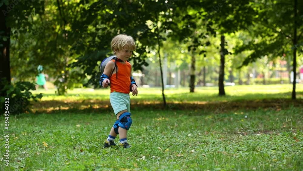 Little boy in protective equipment threw red ball for jumping Little boy in protective equipment threw red ball for jumping