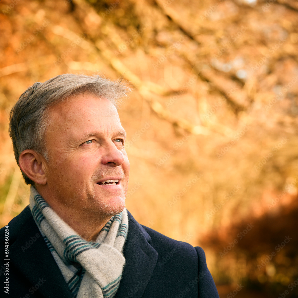 Smiling Senior Man On Walk Through Autumn Park Or Countryside Smiling Senior Man On Walk Through Autumn Park Or Countryside