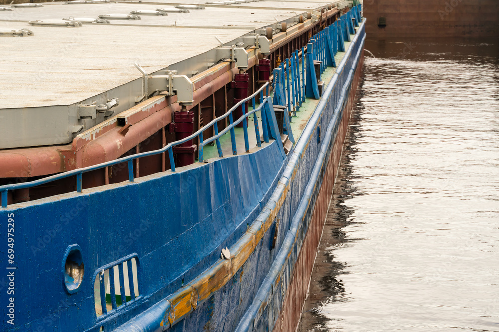 Fototapeta premium Yaroslavl region, Russia, July 9, 2023. Fragment of the side of an old dry cargo ship.